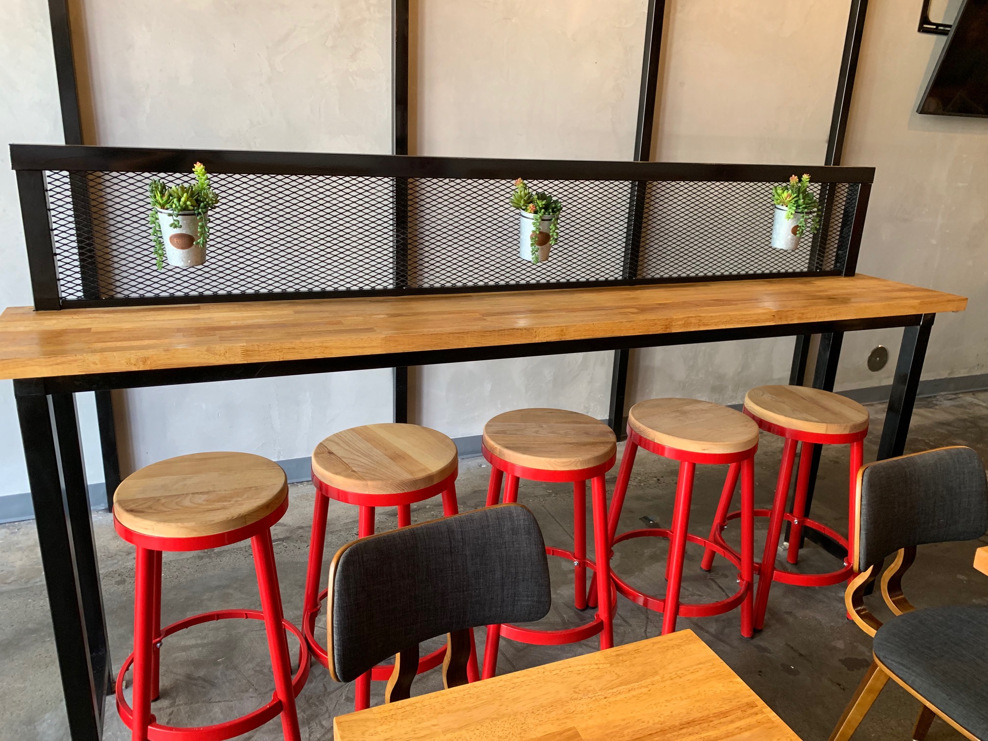 Restaurant dining room with Edison bulb lighting and custom tile work