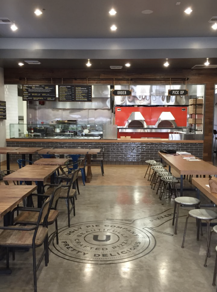 Restaurant order and pickup counter with open kitchen