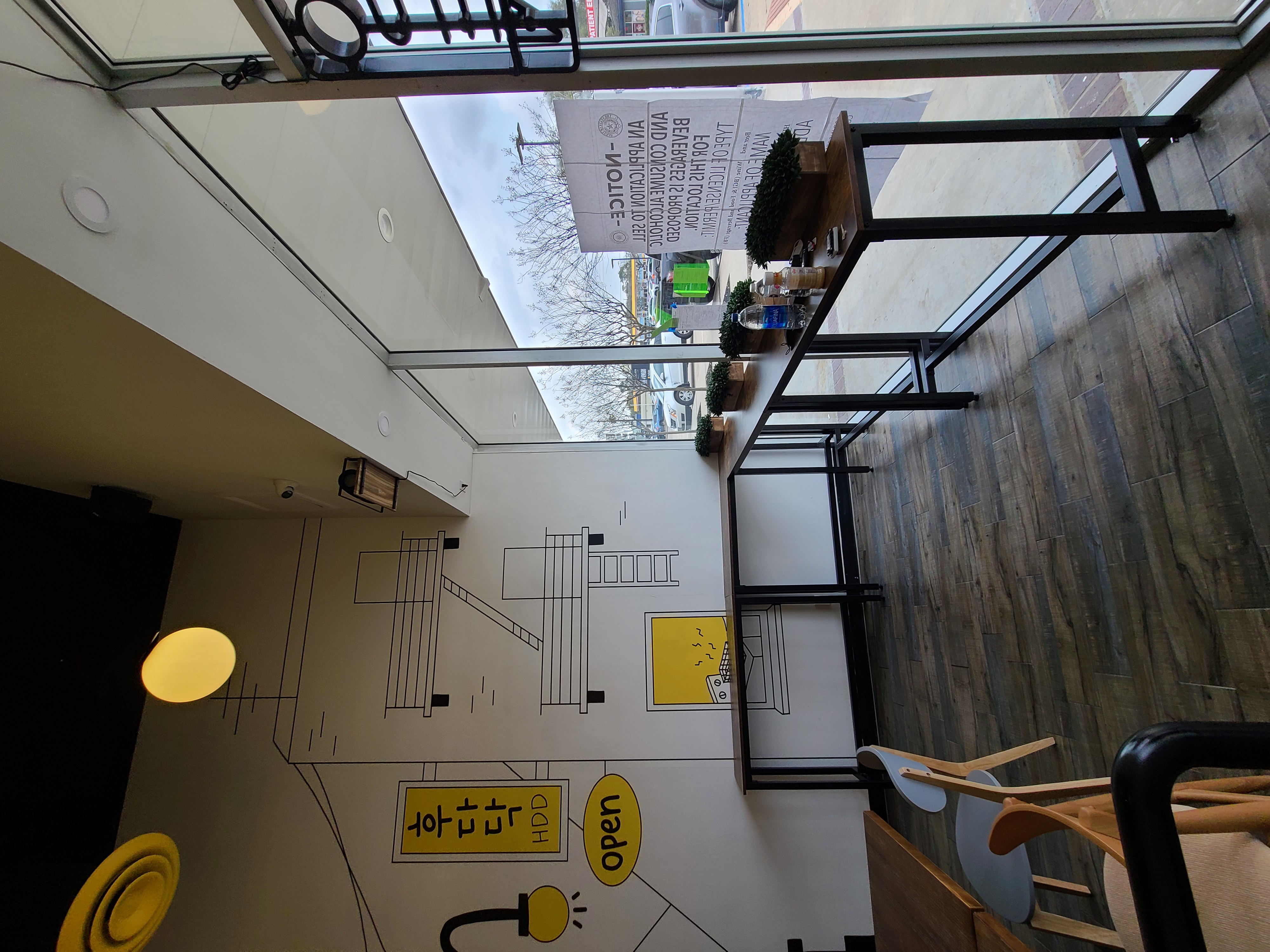 Window seating area with custom mural and bar counter