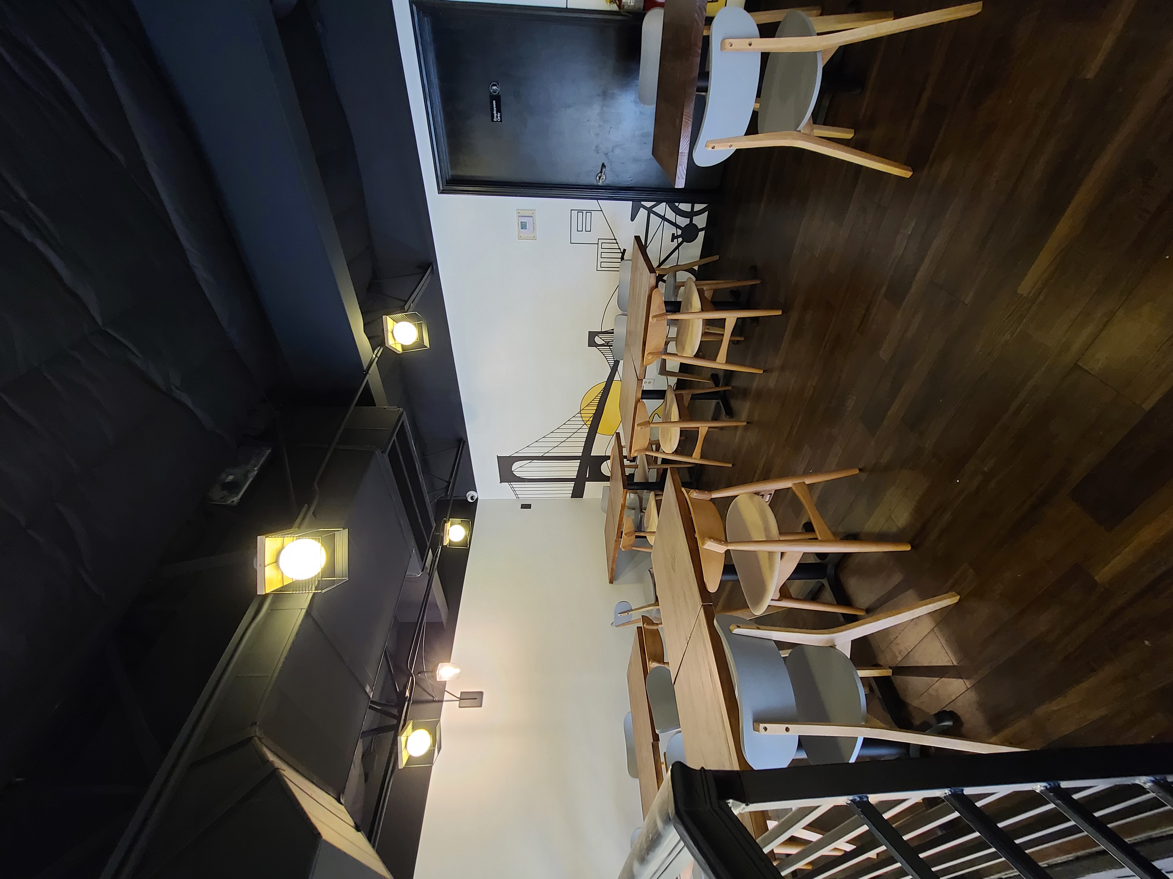Order counter with branded signage and mezzanine above
